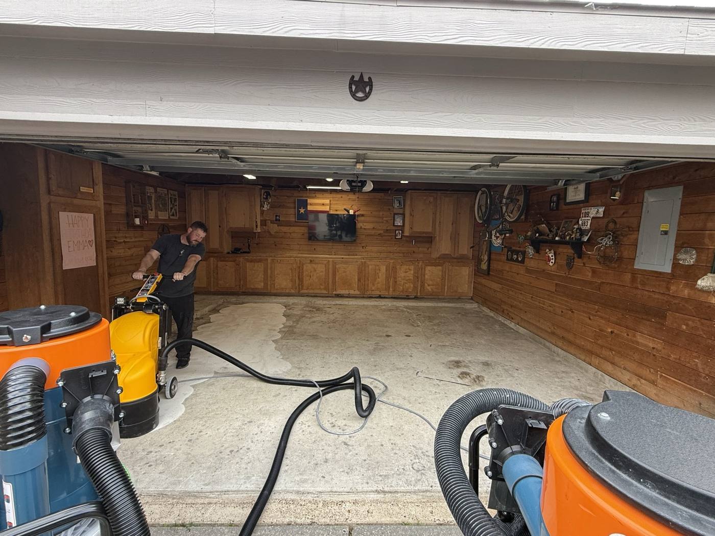 Bare concrete garage floor during diamond grinding