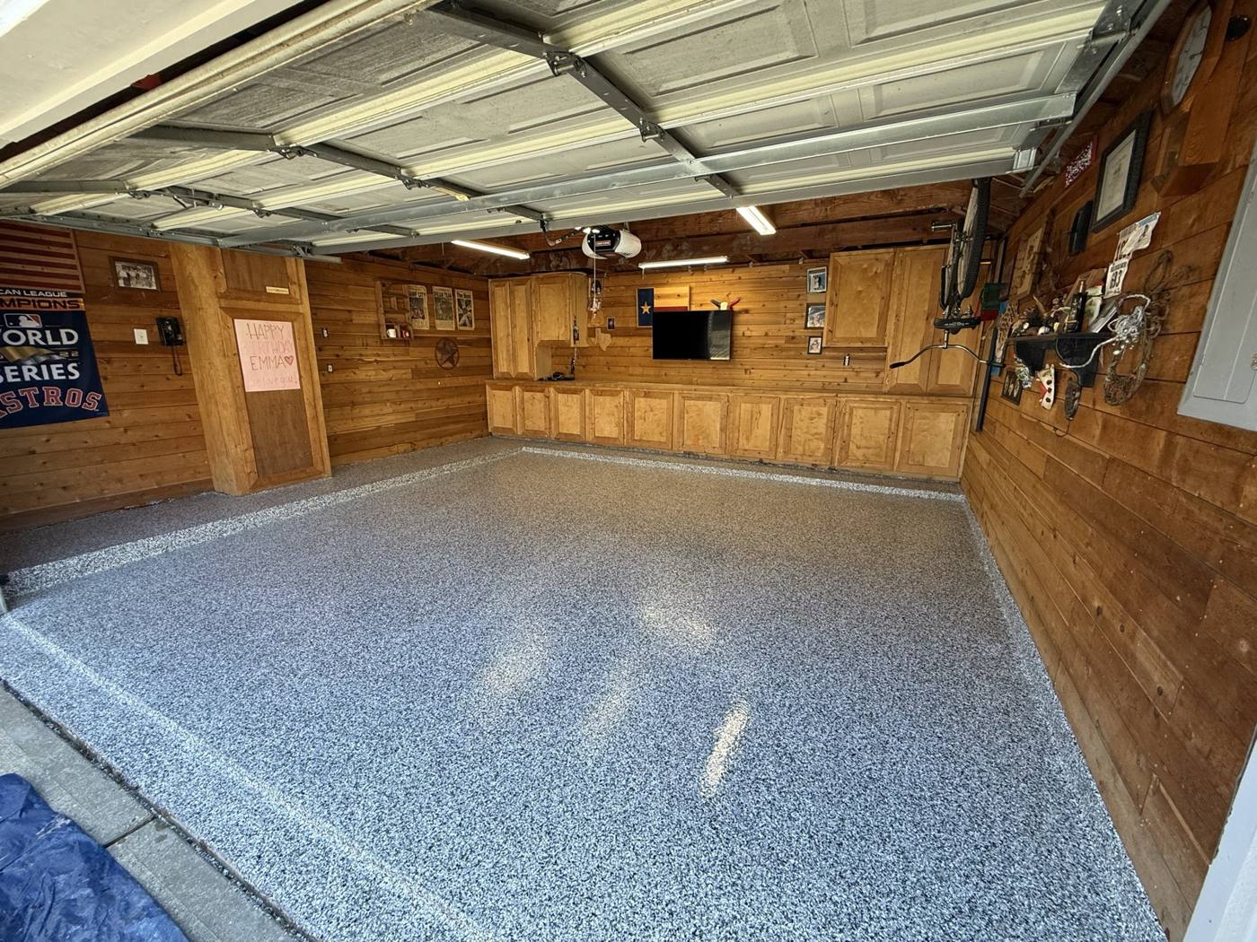 The same garage with a finished gray flake epoxy floor