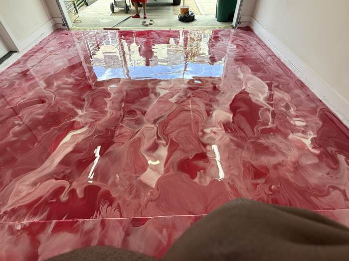 Burgundy metallic epoxy floor with white marbled veining