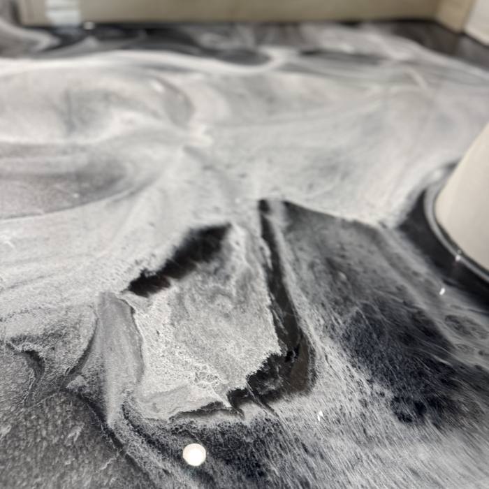 Black and silver metallic epoxy swirl detail