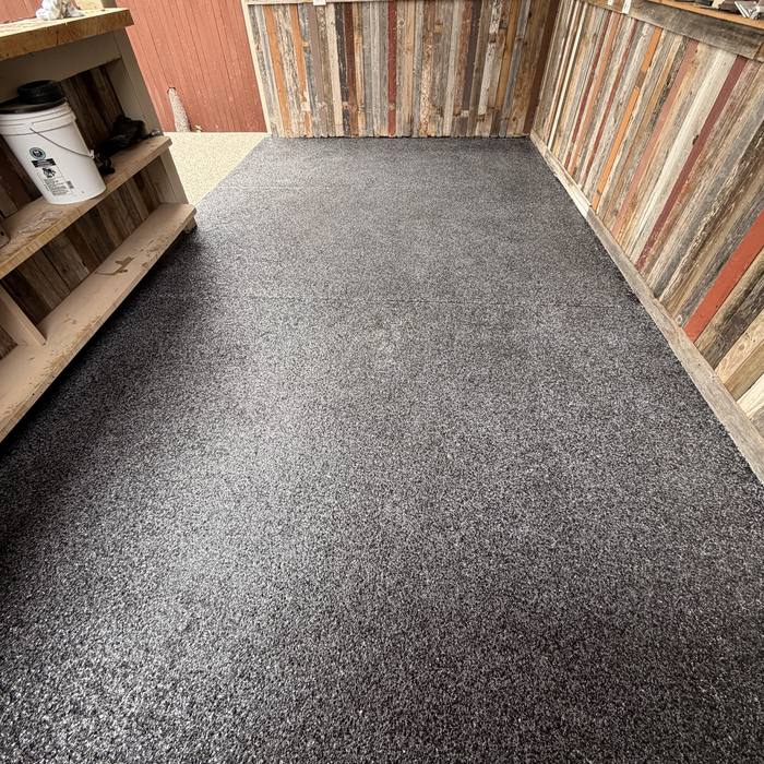 Black flake coating applied to a vertical feature wall