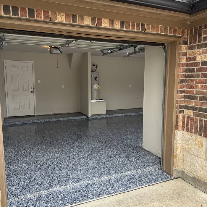 Gray flake epoxy garage floor near the door